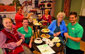 CUPPA. Staff and residents at Colten Care's Lymington home, Linden House, enjoy their coffee and cakes for Macmillan World's Biggest Coffee Morning. Front, from left: Dorothy Ilston, Emily Copeland, Frances Evans and Isaac Curtis. Seated behind are Mandy Stevens and Lin Lee.