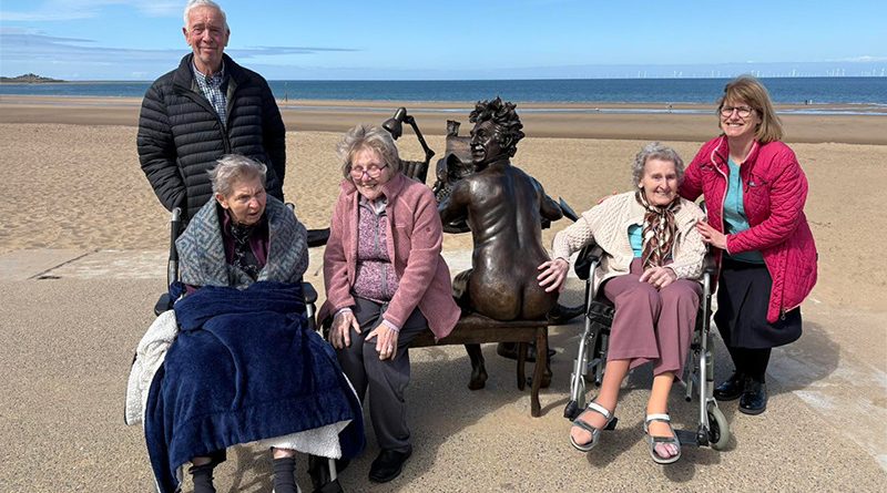 Residents and Staff at Colwyn Bay Home Make Short Journey to Beach to See Terry Jones Statue